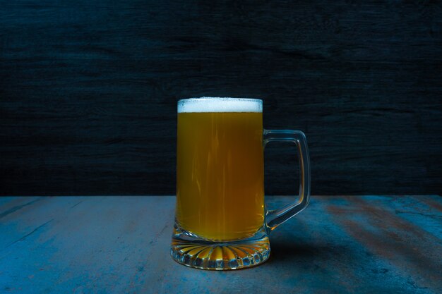 oktoberfest jar of beer textured foam on dark food style