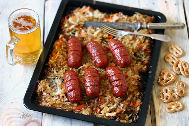 Oktoberfest menu. Baked sauerkraut with sausages.