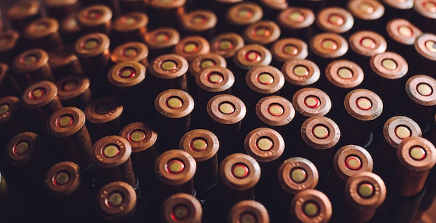 Old 7.62mm bullets on wooden table, back view