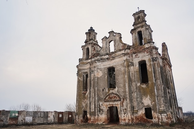 Old abandoned abandoned church. autumn gray background