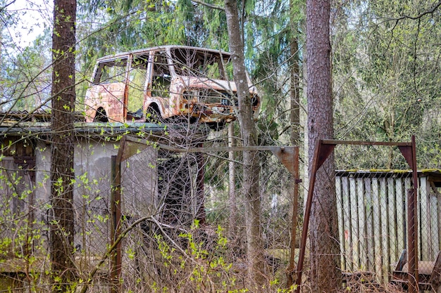 old abandoned car kuzav on the roof of the barn