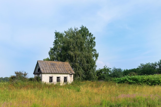 Old abandoned house in the field