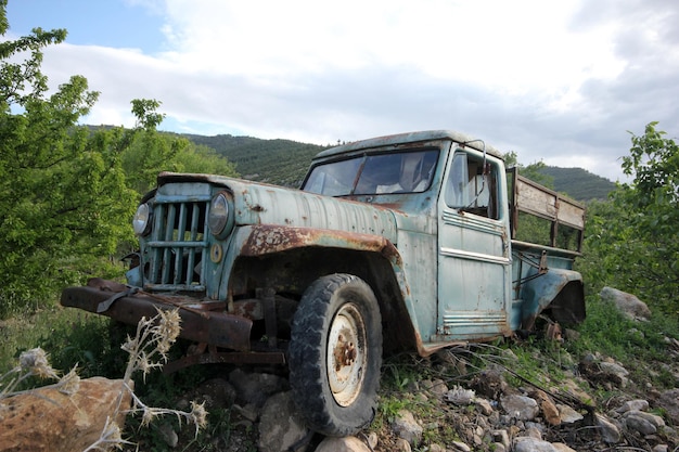 Old abandoned pickup truck in the meadow