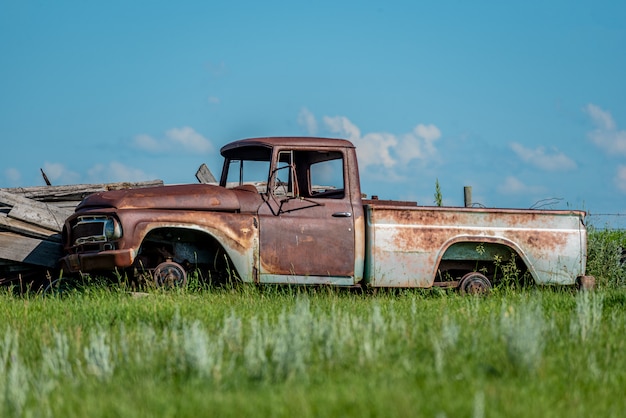 Old abandoned truck in junk yard on the prairies in saskatchewan