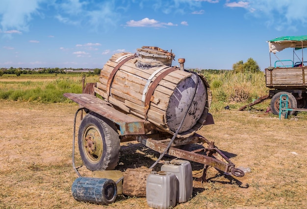 Old abandoned water barrel on wheels