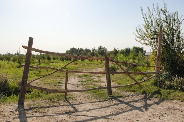 Old abandoned wooden fence on the farm