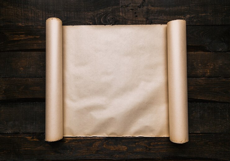 Photo old aged paper roll on dark wooden table planks background. flat lay quest adventure creative concept. room for text, copy, lellering.