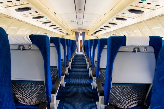 Photo old airplane interior. empty cabin of an aircraft.