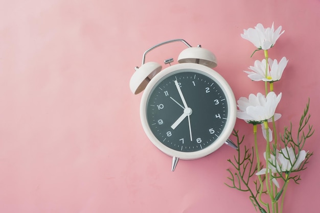 Old alarm clock on wooden background