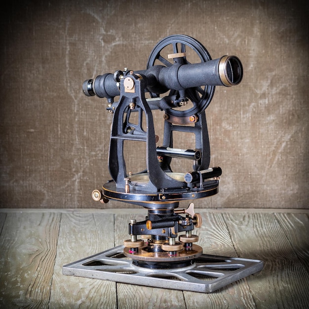 Old american geodetic instrument theodolite in retro style