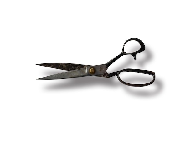 Old or antique fabric scissors isolated on white background with clipping path