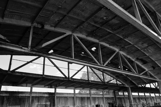 Old arched metal structures abandoned air hangar