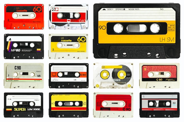 old audio cassette collection on a white background