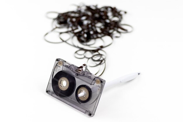 Old audio cassette with loose tape