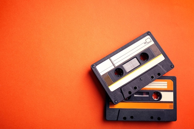 Old audio cassettes on red background