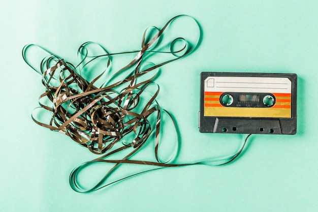 Old audio cassettes on turquoise table