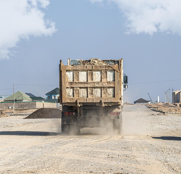 Old auto dump truck truck at a construction site