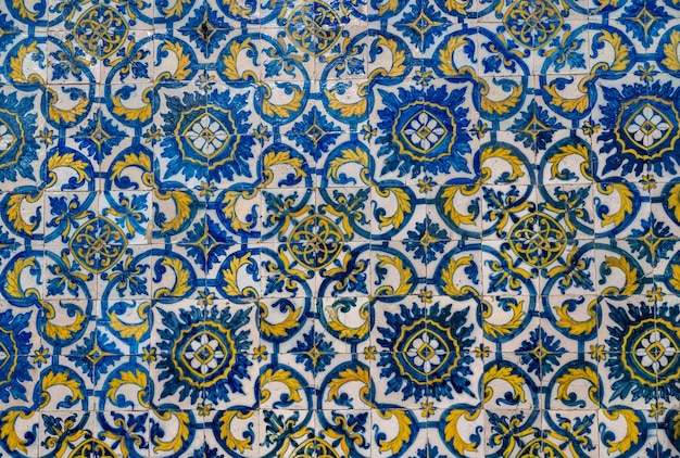 Old azulejo tiling on wall in traditional Portuguese style