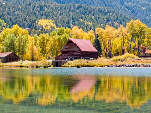 Old barn by the lake in autumn. Near Lake City, Colorado.