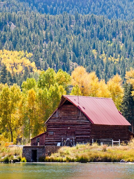 Old barn by the lake in autumn. Near Lake City, Colorado.