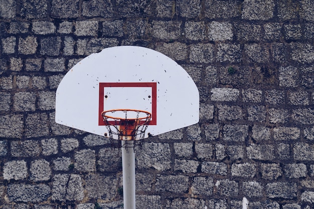 old basketball hoop in the street