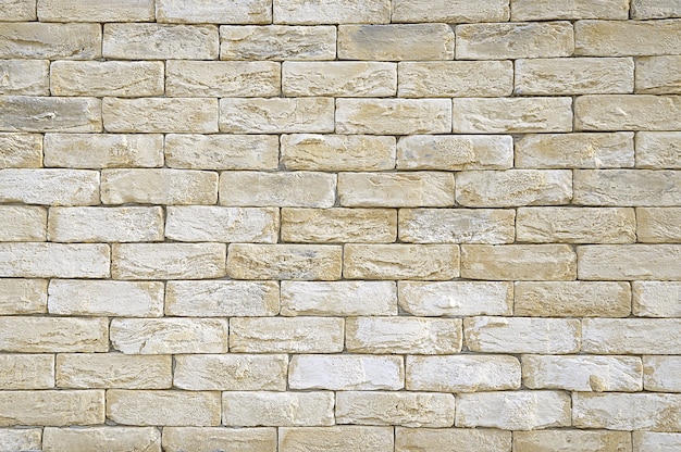 Old beige brick wall texture