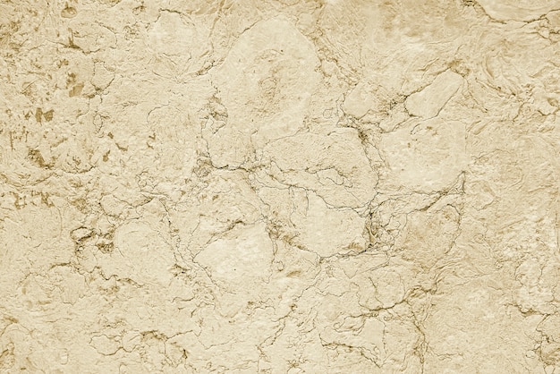 Old beige stone granite wall background texture