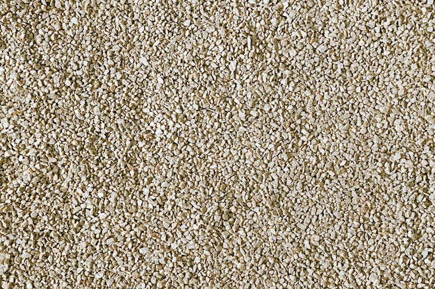 Old beige stone pavement background close up