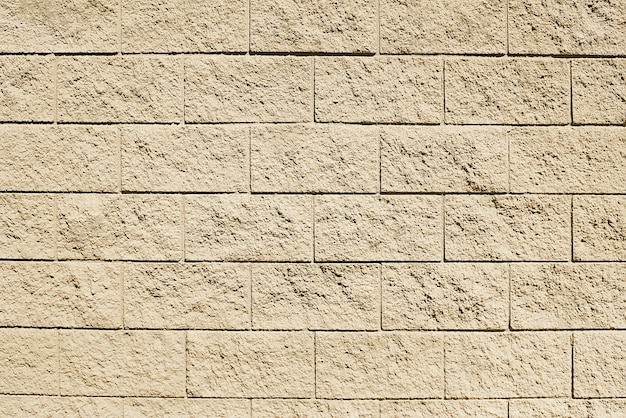 Photo old beige stone wall background texture