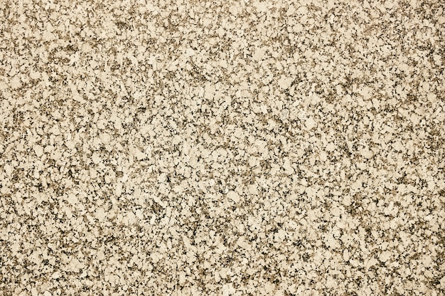 Old beige stone wall background texture