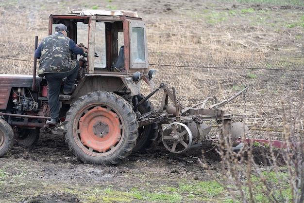 Old Belarus tractor on a ground.