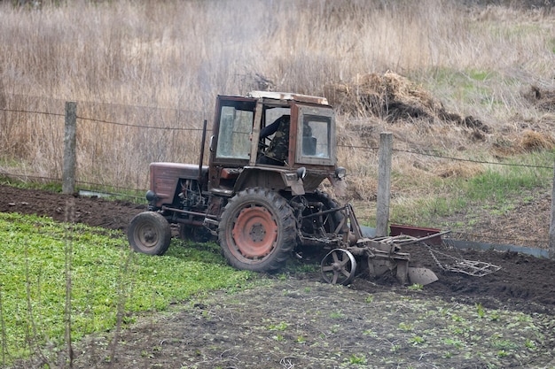 Old Belarus tractor on a ground.