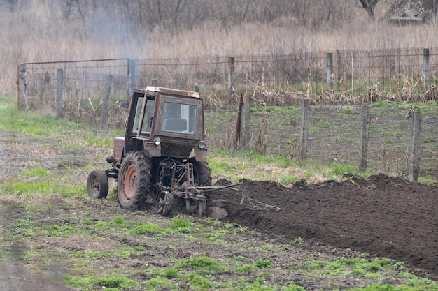 Old Belarus tractor on a ground.