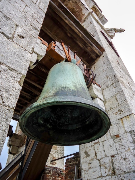 Photo old bell of the belfry in siena