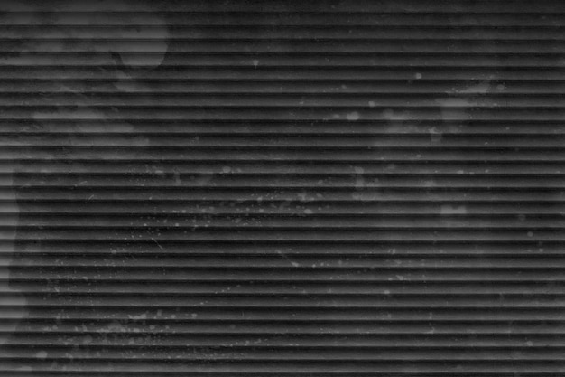 Old black striped background. Metal fence texture