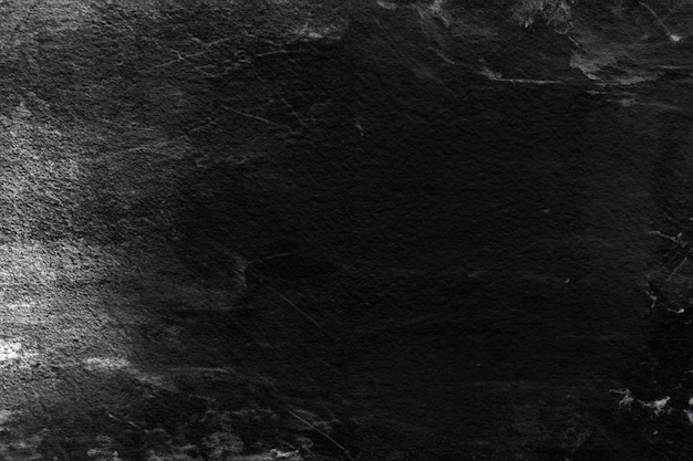 Фото Старая черная штукатурка на стене с белыми царапинами и потертостями текстурированный гранж-фон для дизайнеров