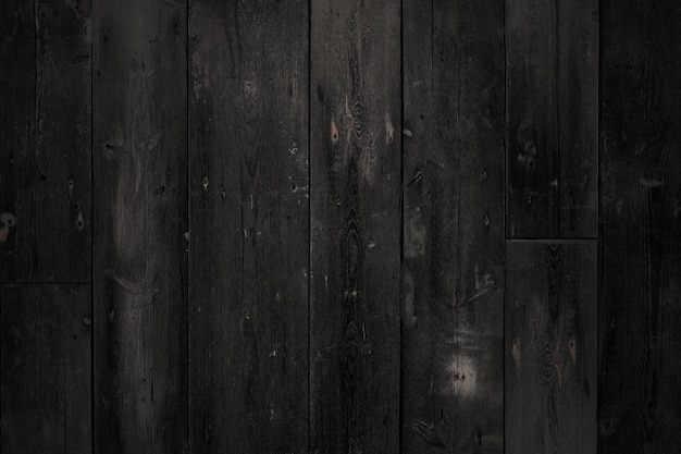 Old black wooden background. Dark timber board