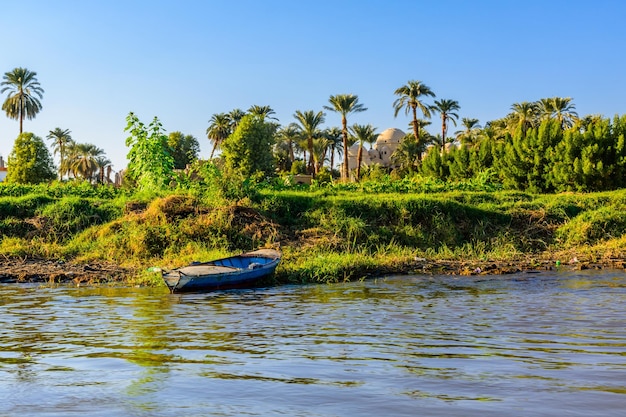 Old boat near the bank of the Nile river