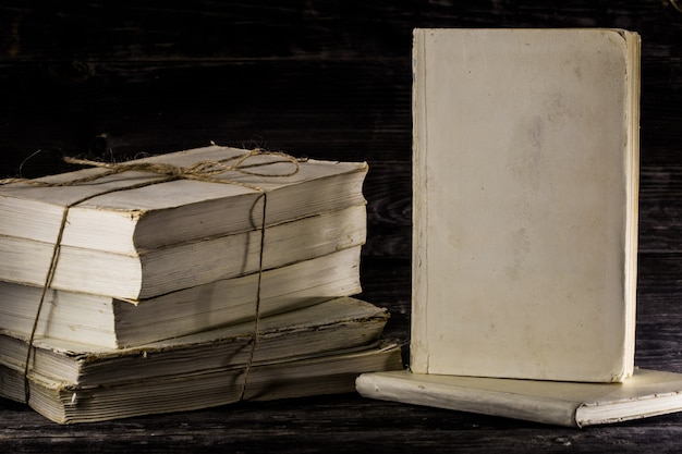 Photo old book on wooden background.