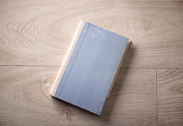 Old book on wooden background