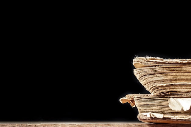 Old book on a wooden table on blank surface