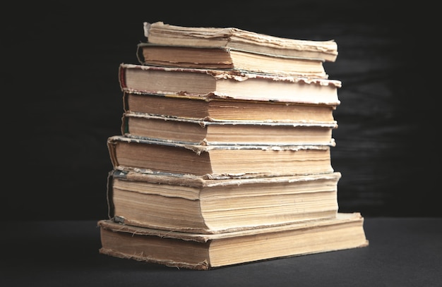 Old books on the black background.