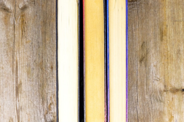 Old books on rustic wooden shelf