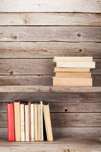 Old books on a wooden shelf