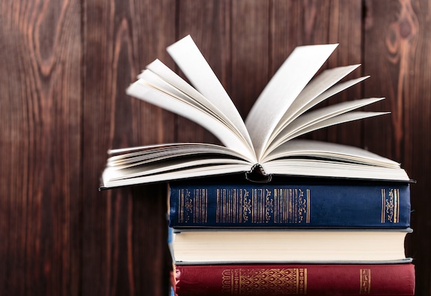 Old books on wooden table. The source of information