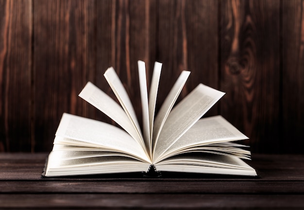 Old books on wooden table. The source of information