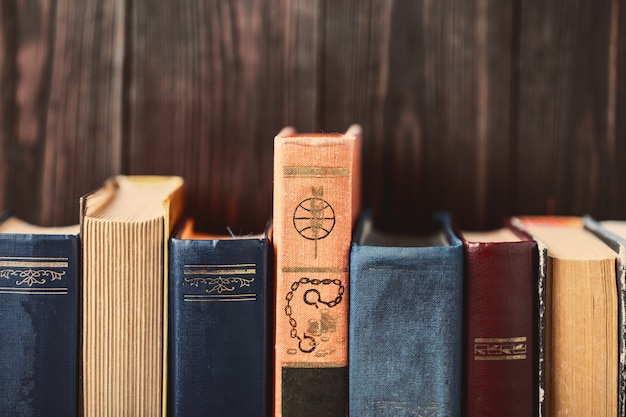 Photo old books on wooden table. the source of information