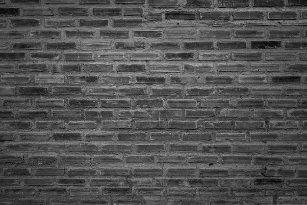 old brick wall background with black and white filter