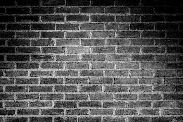 old brick wall background with black and white filter