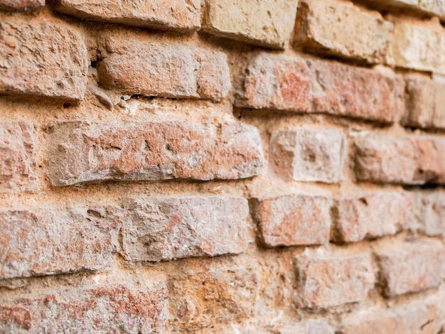 Old brick wall closeup side view. Background of bricks. Background texture.